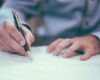 Businessman with pen and paper