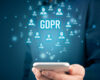 Man holding phone displaying GDPR concept