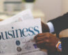 Businessman reading newspaper