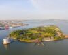 Governors Island and Castle Williams aerial view from New York Harbor, New York City, New York NY, USA.
