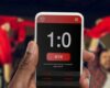 Device screen with mobile app for betting and score.