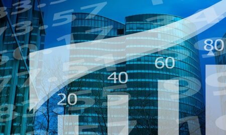 Stocks charts on a background of business buildings