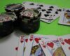 Casino chips and cards on a green table