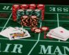Casino card game showing chips on green cloth background